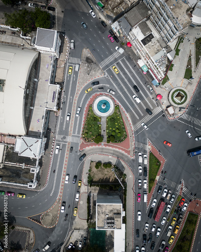 Aerial view of a busy roundabout with vehicles and modern buildings, Pathum Wan, Thailand. photo