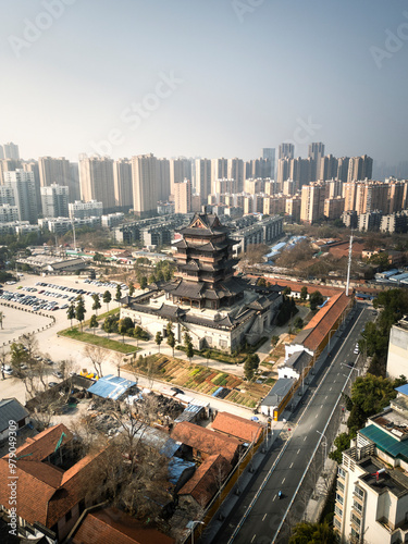 Aerial view of Guiyuan Temple surrounded by a beautiful cityscape at sunset, Wuhan, China. photo