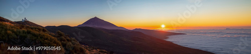 Scenery of a place with astronomical observatory, the Teide volcano and a sea of clouds. All this at dusk with a magical light