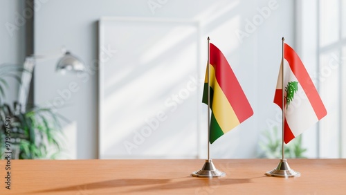 FLAGS OF BOLIVIA AND LEBANON ON TABLE