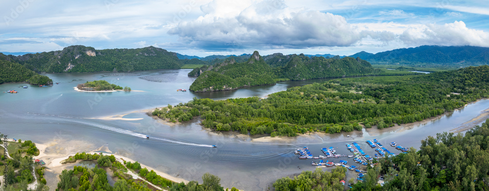 Aerial view of a beautiful beach with a clear lake and boats near an island, Tanjung Rhu, Malaysia. Aerial view of a beautiful beach with a clear lake and boats near an island, Tanjung Rhu, Malaysia.