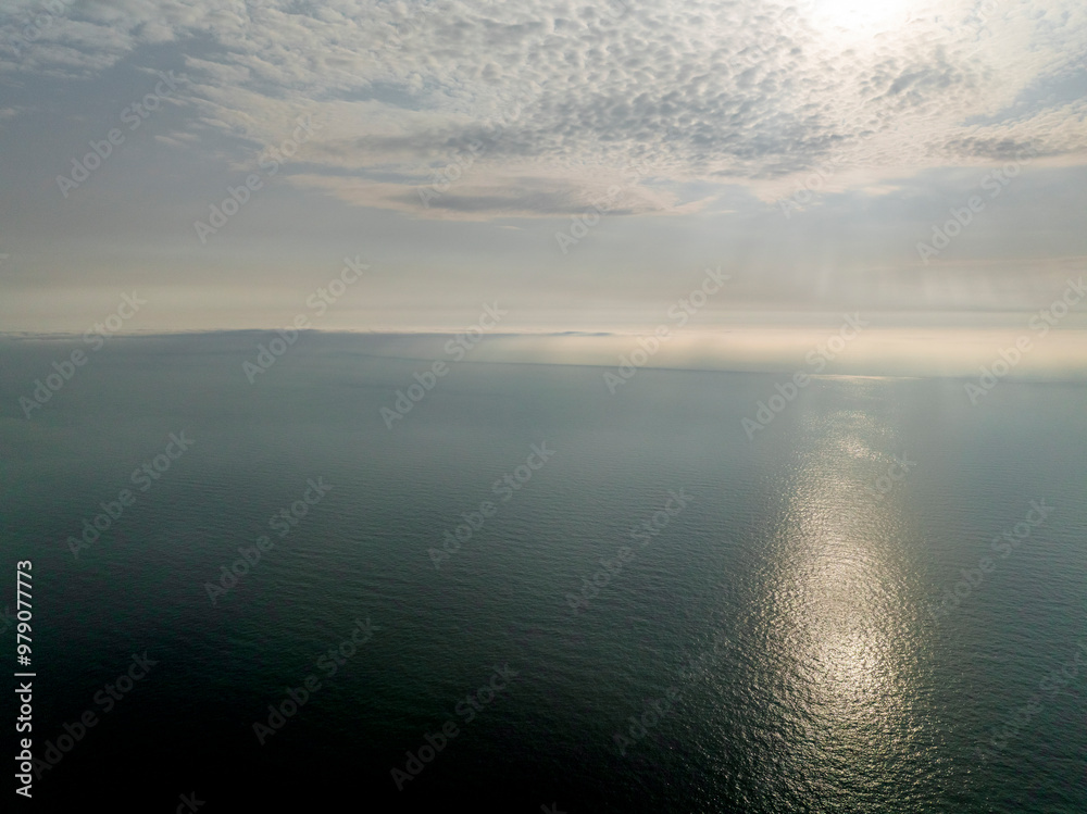 Aerial view of the breathtaking white cliffs of Dover against the serene English Channel with a beautiful sunset, St Margaret's at Cliffe, England. Aerial view of the breathtaking white cliffs of Dover against the serene English Channel with a beautiful sunset, St Margaret's at Cliffe, England.