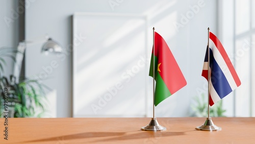 FLAGS OF BURKINA-FASO AND THAILAND ON TABLE