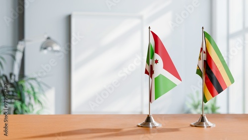 FLAGS OF BURUNDI AND ZIMBABWE ON TABLE