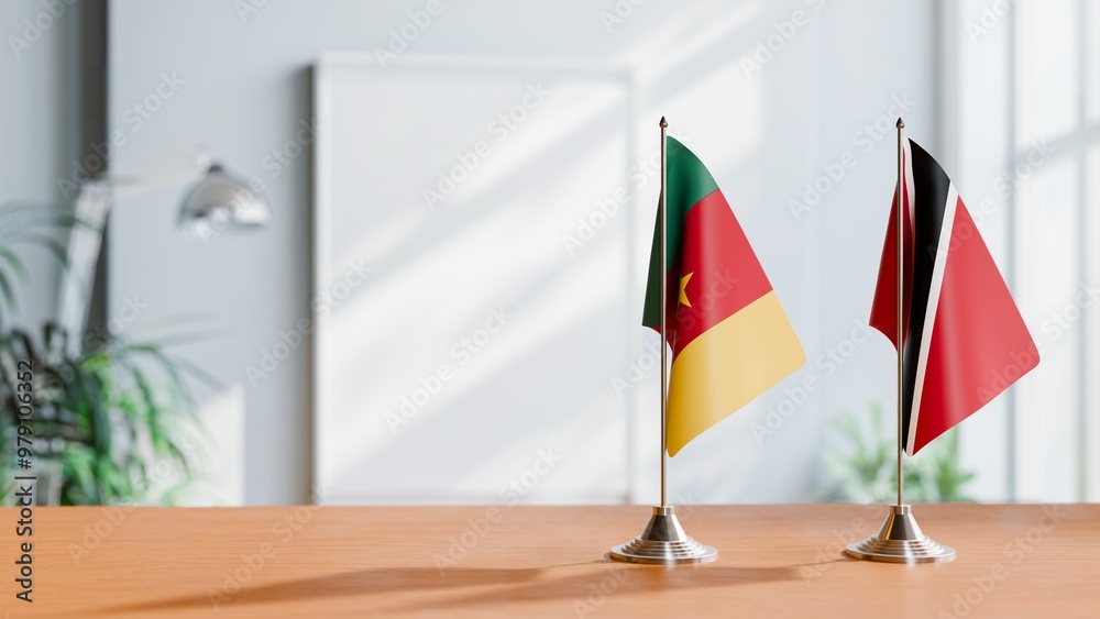 FLAGS OF CAMEROON AND TRINIDAD ON TABLE FLAGS OF CAMEROON AND TRINIDAD ON TABLE