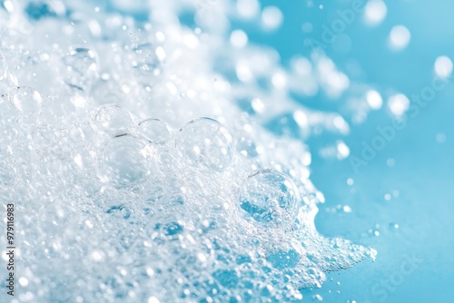 splash of white water foam on light blue grunge background