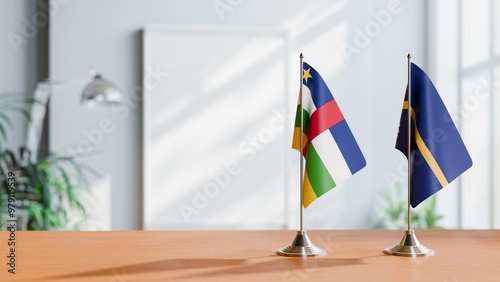 FLAGS OF CENTRAL AFRICAN REPUBLIC AND NAURU ON TABLE photo