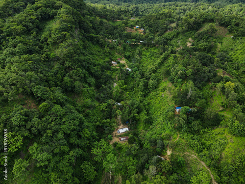 Aerial view of beautiful chittagong hills with tribal homes surrounded by lush forest, Chittagong, Bangladesh. photo