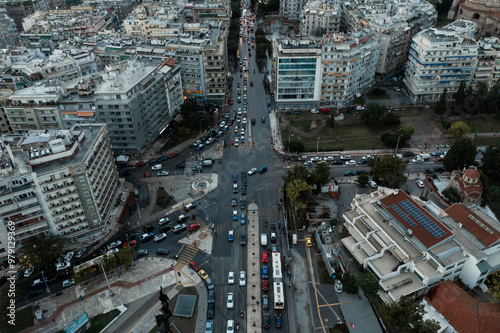 Aerial view of bustling city traffic at a busy intersection surrounded by modern buildings, Thessaloniki, Greece. photo