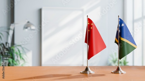 FLAGS OF CHINA AND SOLOMON ISLANDS ON TABLE