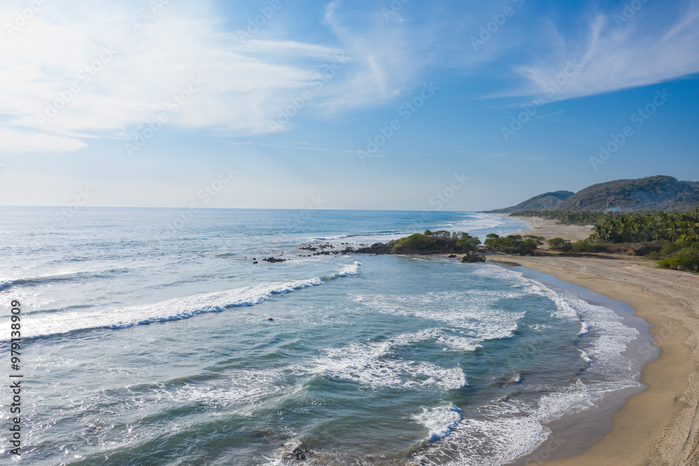 Aerial view of beautiful sandy beach with tranquil waves and serene ocean, Playa Troncones, Mexico. Aerial view of beautiful sandy beach with tranquil waves and serene ocean, Playa Troncones, Mexico.