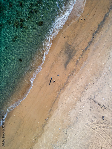 Aerial view of serene Adan Beach with clear blue water and sandy shoreline, Kunigami Son, Japan. photo