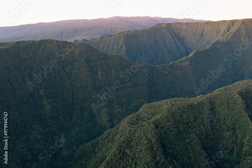 Aerial view of majestic Takamaka mountains at dawn surrounded by mist and lush valley, Saint Benoit, Reunion. photo