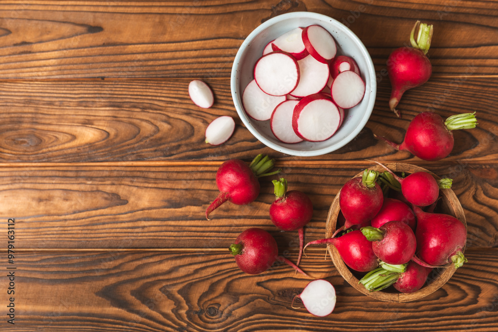 Fresh radish on textured wooden background. Organic natural garden radish slices. clipping root crop. Vegetables. Vegan. Diet products. Healthy food. Place for text. Copy space.