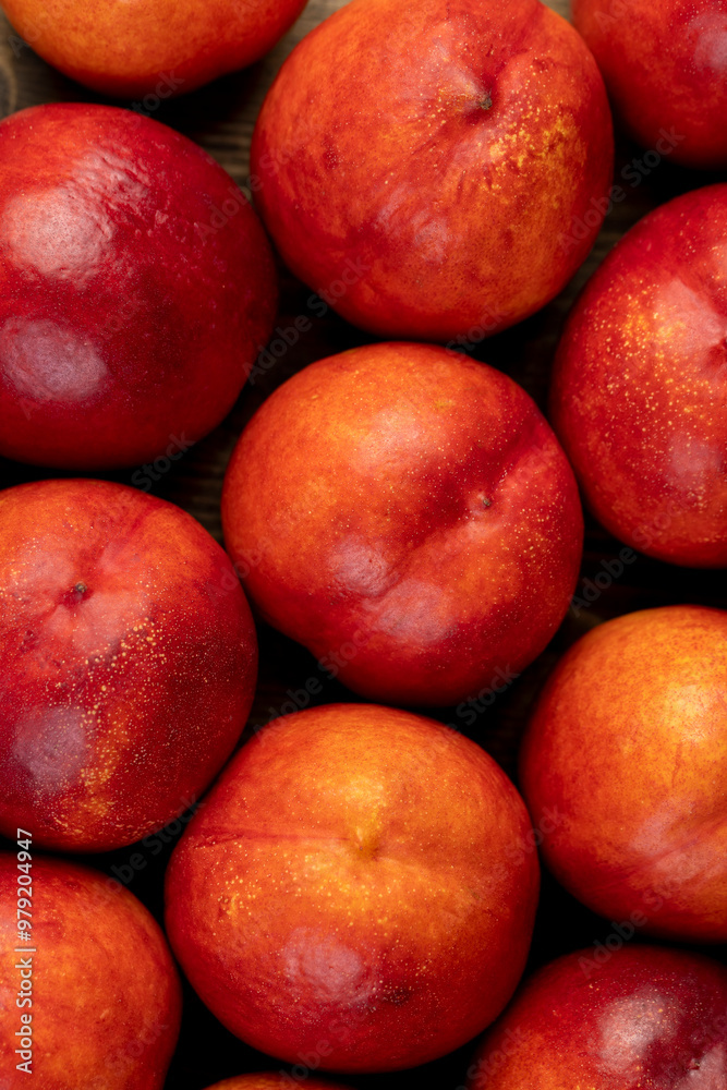 a large number of ripe soft nectarine fruits on the table a large number of ripe soft nectarine fruits on the table