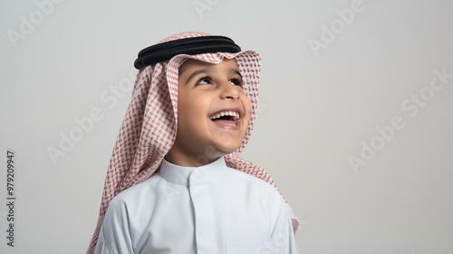 Arabian Saudi boy wearing traditional clothing isolated