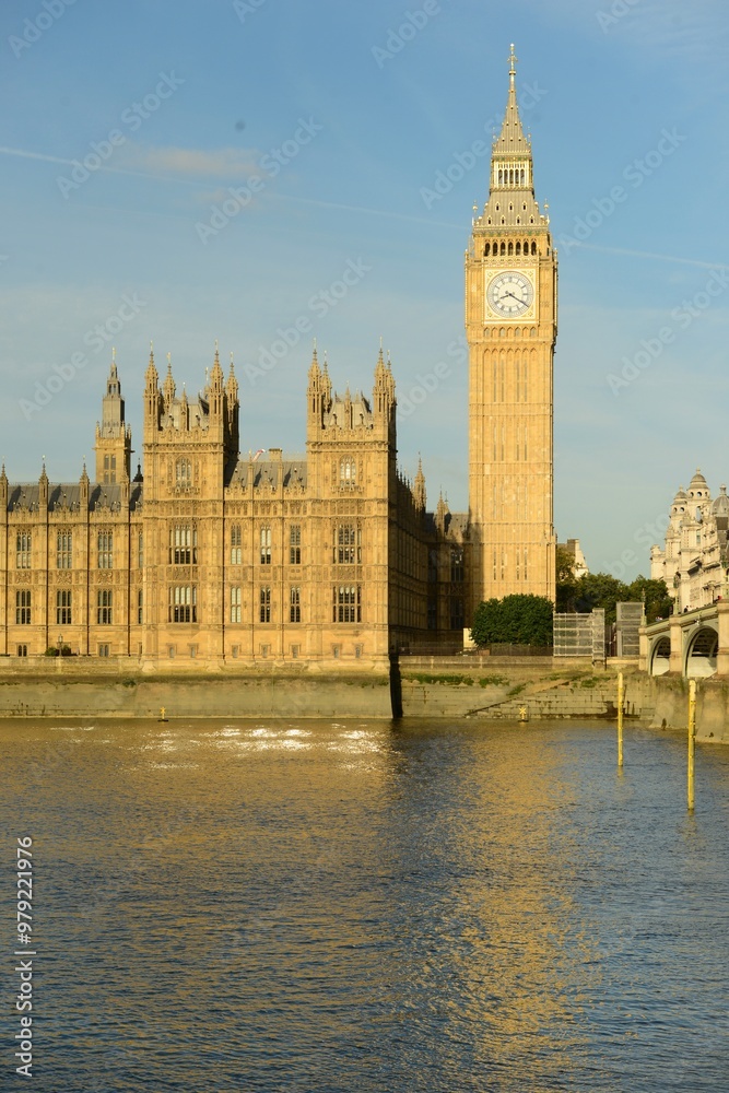 Parliament building and Westminster bridge, London, England, U.K. The Cities government with Big Ben clock tower and the river Thames on a sunny September day. Parliament building and Westminster bridge, London, England, U.K. The Cities government with Big Ben clock tower and the river Thames on a sunny September day.