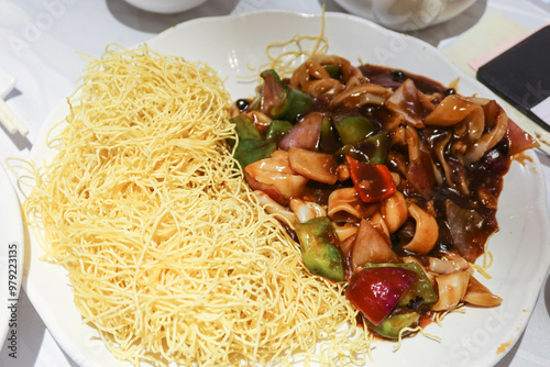 close up of Chinese Canton style deep fried noodles and with soy sauce Solenidae 