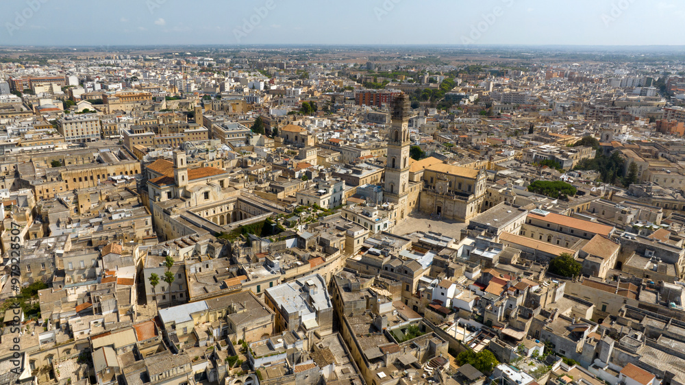 Aerial view of the church of Santa Irene and cathedral of Lecce, in Apulia, Italy. These two churches are located in the historic center of the city. Aerial view of the church of Santa Irene and cathedral of Lecce, in Apulia, Italy. These two churches are located in the historic center of the city.