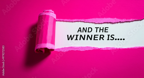 Torn paper winner announcement with creative design on pink background showcasing celebration theme
