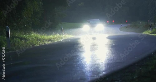 Strassenverkehr, Autos fahren in der Dämmerung auf einer Landstraße bei Regen, Bayern, Deutschland, Europa photo