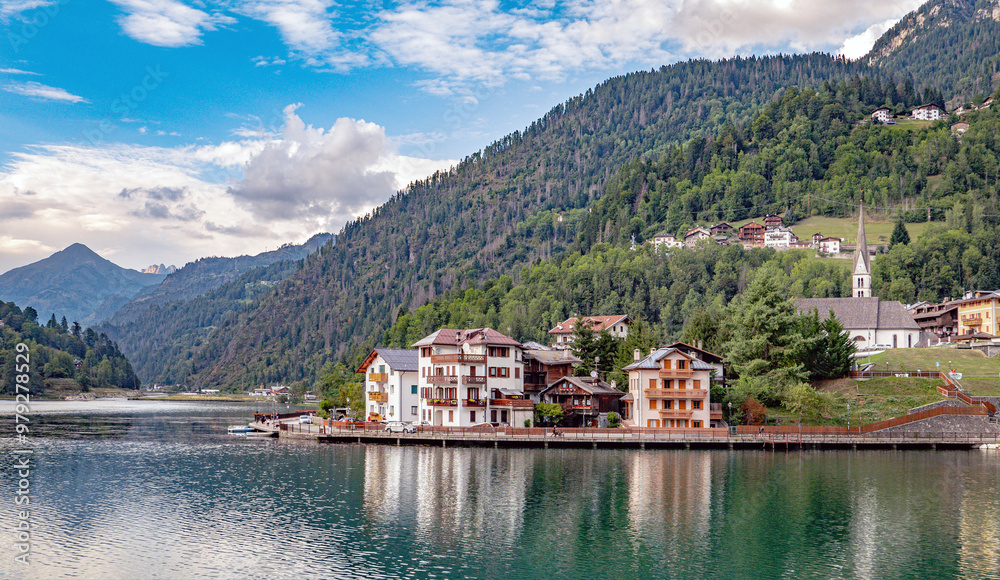 Fototapeta premium Alleghe, Veneto, Italy: Houses on the banks of the Lake Alleghe
