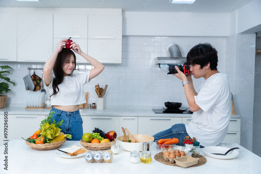 Happy portrait of loving young asian of having fun standing Take a photo after enjoy cook cooking with vegetables, meat, bread while standing on a kitchen Condo life or home Happy portrait of loving young asian of having fun standing Take a photo after enjoy cook cooking with vegetables, meat, bread while standing on a kitchen Condo life or home