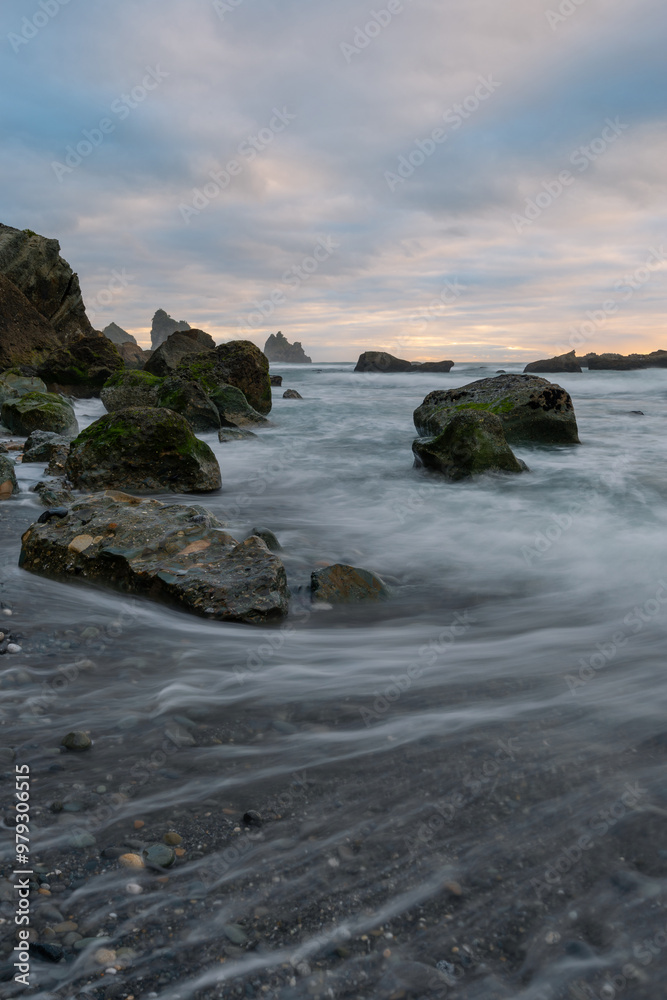 Water flowing on the rocky coastline. Water flowing on the rocky coastline.
