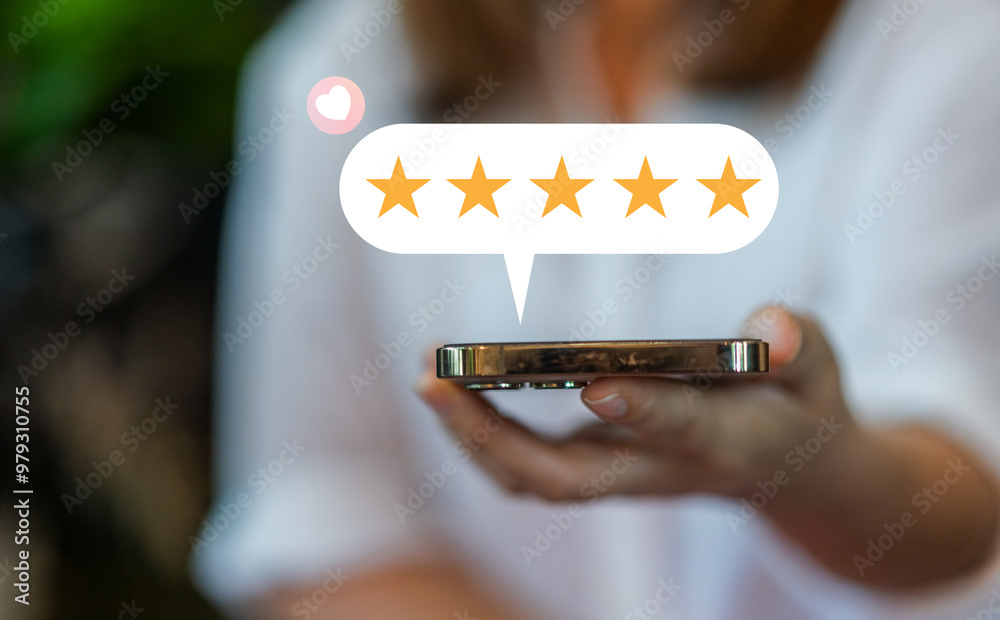 Customer satisfaction feedback with five star rating system, hand hold ...