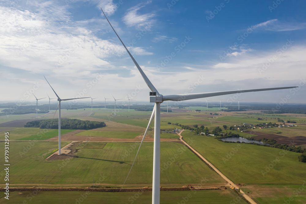 Wind turbine farm from aerial view in Lithuania. Renewable and sustainable green power concept Wind turbine farm from aerial view in Lithuania. Renewable and sustainable green power concept