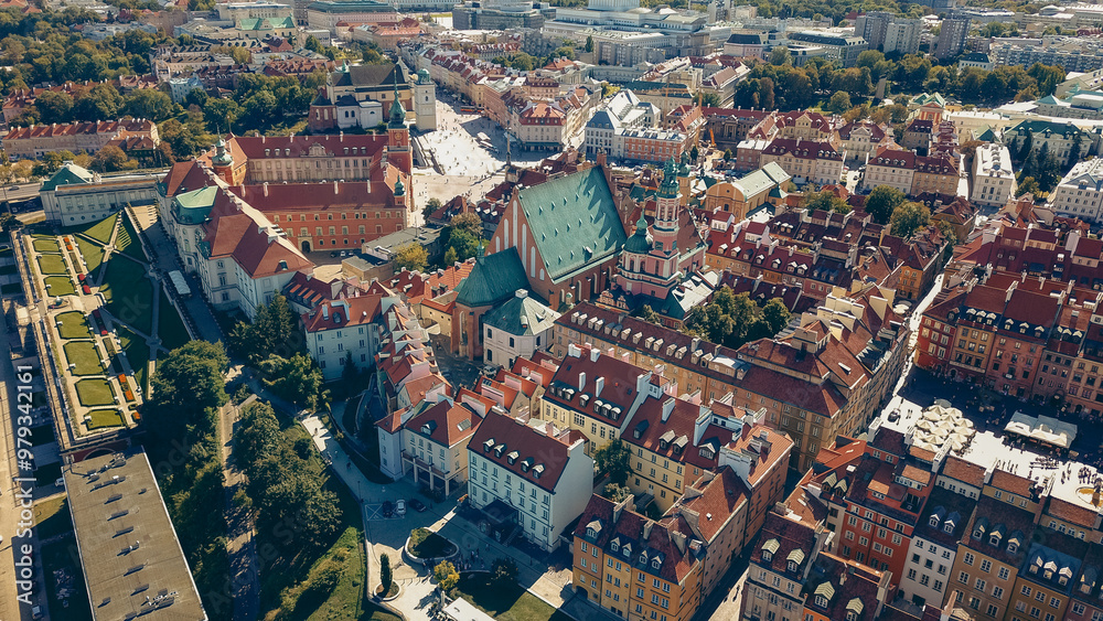 Fototapeta premium Aerial view of Warsaw's historic architecture and vibrant rooftops during a sunny day in late summer