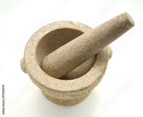 Light Brown Ang Sila stone mortar with pestle, top view, isolated on white background.