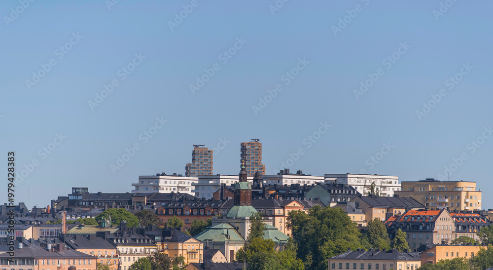 Obraz premium Apartment houses and skyscrapers on the island Kungsholmen and the district Vasastan, a sunny summer day in Stockholm