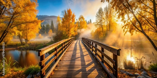 Vibrant autumn foliage along West Kelowna's scenic trails, featuring rustic wooden bridges, misty fog, and warm backlight, shot with a shallow depth of field and polarizing filter.