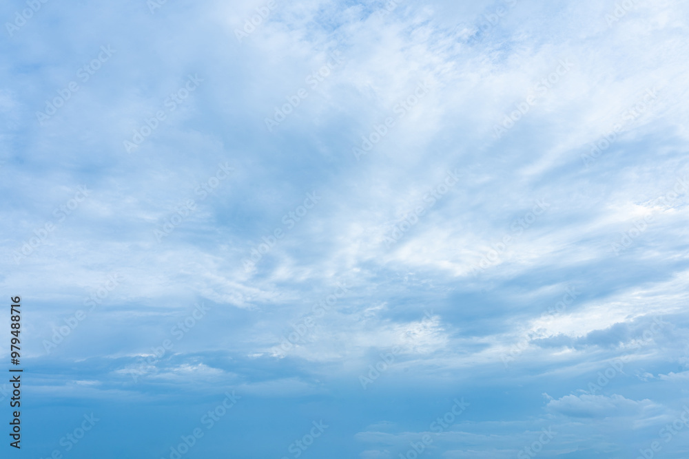 Fluffy white clouds drift across a vibrant blue sky, creating a breathtaking natural masterpiece Fluffy white clouds drift across a vibrant blue sky, creating a breathtaking natural masterpiece