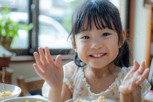 Family moment curious face plate of food front. Playful child adorable expression shows curiosity meal. Endearing moment of waiting meal represents patience. photo