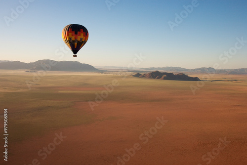 Aerial view of The hot-air balloon shortly before take-off in the light of the early morning. Namib Desert, NamibRand Nature Reserve, Namibia. photo