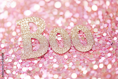 Multicolored iridescent sequins background with word Boo, Halloween concept photo