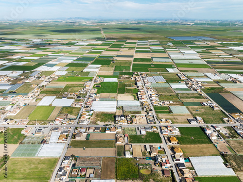 Aerial view of The semi rural district of La Algaida with its cultivated fields next to Sanlúcar de Barrameda. Aerial view. Drone shot. Cádiz province, Andalusia, Spain. photo