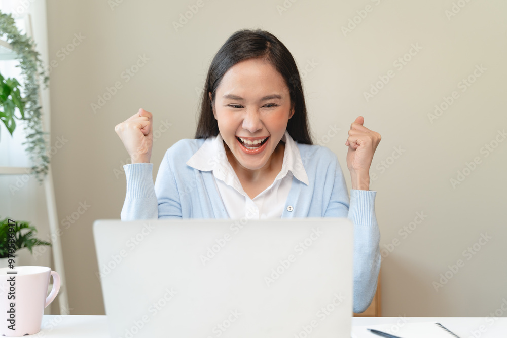 Good news reaction concept, Young adult females reading emails and have joyful expressions after receiving an offer of a job promotion from the company. Good news reaction concept, Young adult females reading emails and have joyful expressions after receiving an offer of a job promotion from the company.