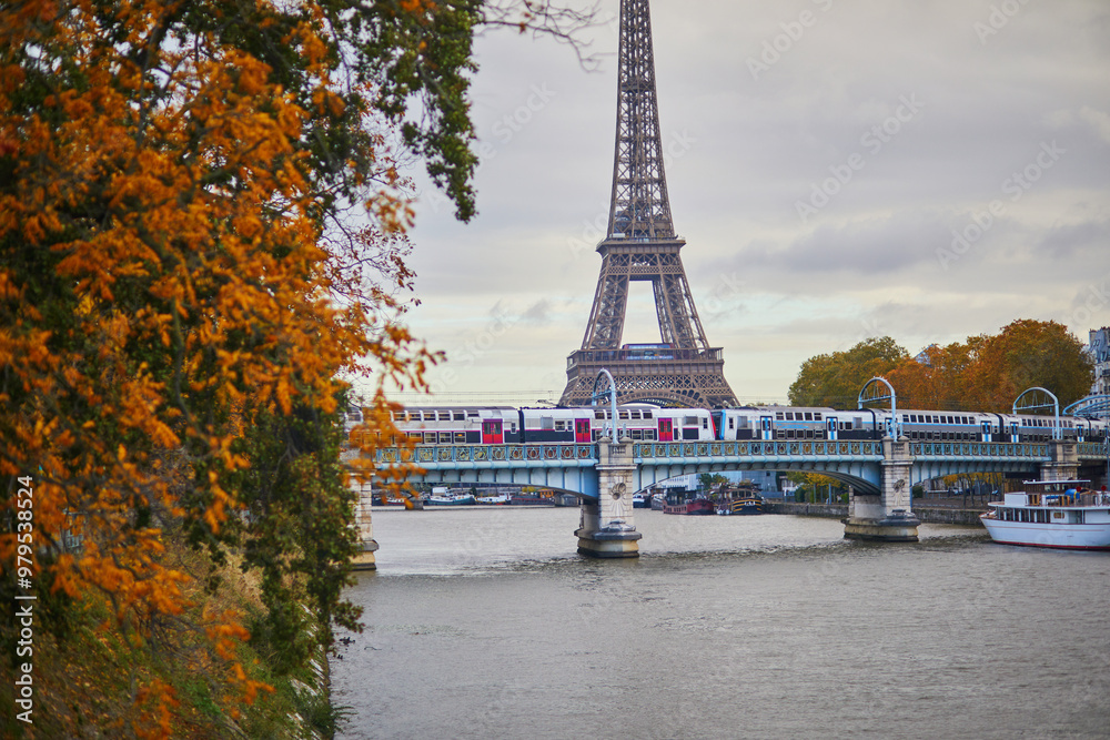 Scenic view to the Eiffel tower over the river Seine on a nice autumn day in Paris. Scenic view to the Eiffel tower over the river Seine on a nice autumn day in Paris.