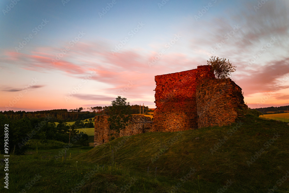 Perimeter walls of the collapsed Borotín castle in the Tábor district in southern Bohemia at sunrise. Photographed by long exposure technique Perimeter walls of the collapsed Borotín castle in the Tábor district in southern Bohemia at sunrise. Photographed by long exposure technique
