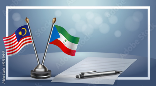 Malaysia and Equatorial Guinea Small national flag on bokeh background, cooperative relationship