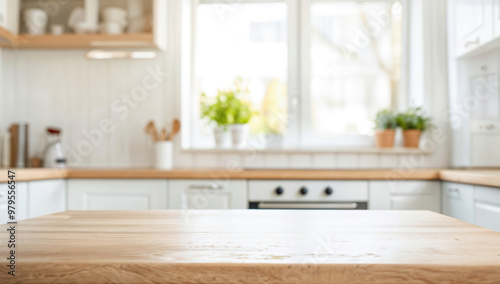 Empty wooden tabletop in front of blurred kitchen background