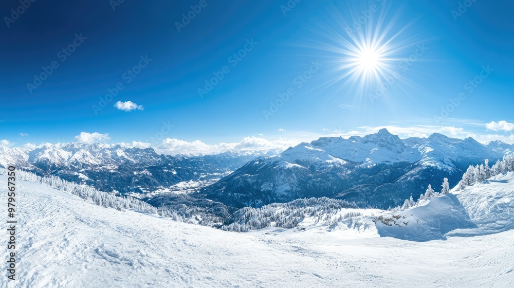 Panoramic view of snow-covered mountains with a clear blue sky and bright winter sunshine. Panoramic view of snow-covered mountains with a clear blue sky and bright winter sunshine.
