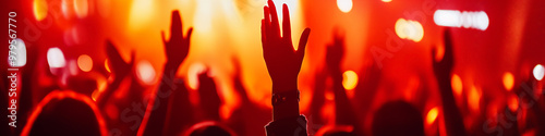 Worshippers raising hands during a vibrant Christian music concert in an energetic atmosphere