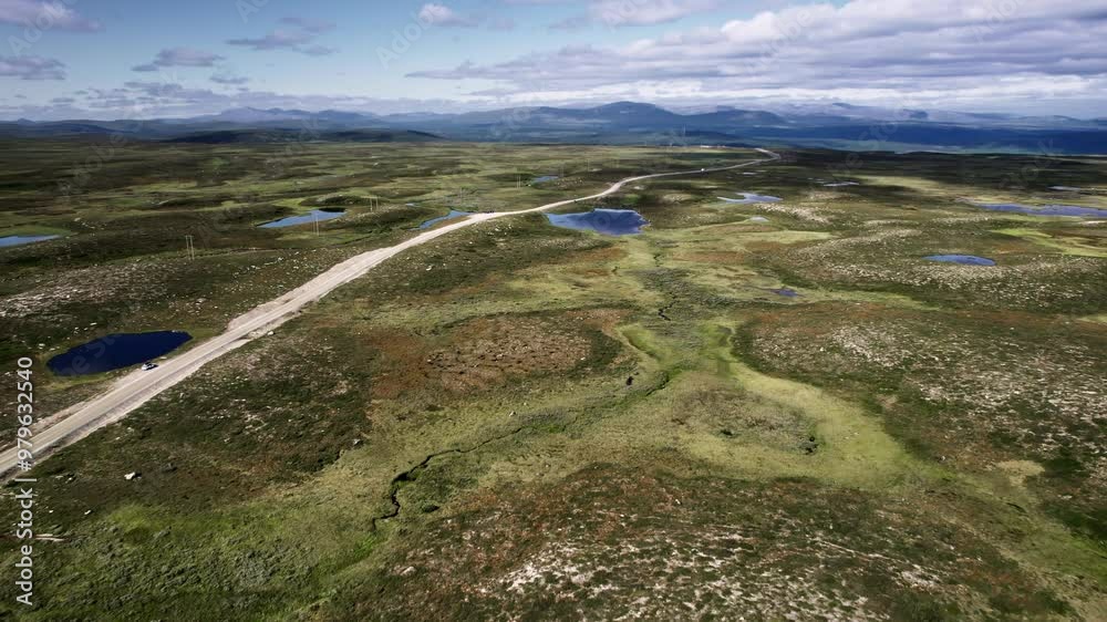 Aerial journey over Flatruet high fell, Flying over winding streams, waterholes, rural road and the vast moorland landscape, revealing stunning natural beauty in Sweden Aerial journey over Flatruet high fell, Flying over winding streams, waterholes, rural road and the vast moorland landscape, revealing stunning natural beauty in Sweden