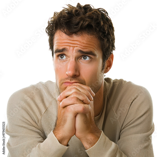 A man with both hands clasped tightly together, looking around nervously with furrowed brows isolated on transparency background photo