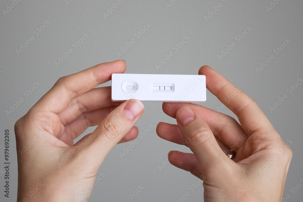 Positive result of antigen covid test in the hands which means that the person is infected with the virus and needs treatment Positive result of antigen covid test in the hands which means that the person is infected with the virus and needs treatment