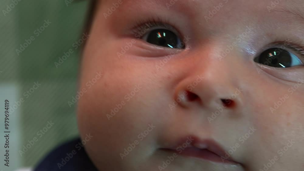 Extreme close-up of a baby’s face, focusing on the eyes and soft facial features. Detailed shot of a curious infant gazing upwards indoors Extreme close-up of a baby’s face, focusing on the eyes and soft facial features. Detailed shot of a curious infant gazing upwards indoors